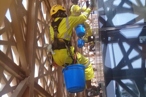rope-access-cleaning-cleveland-clinic-abu-dhabi-yellow-uniform-tetragulfgroup1D5A8D5F-FF7C-1FF7-CE73-A12E33045CE2.jpg